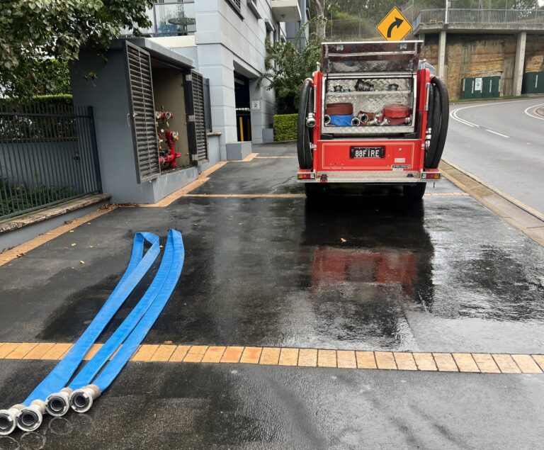 Fyrepower truck from the back and hose reels on the floor after performing hydrostatic pressure test